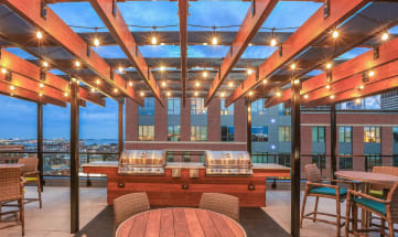 a rooftop bar with a view of the city